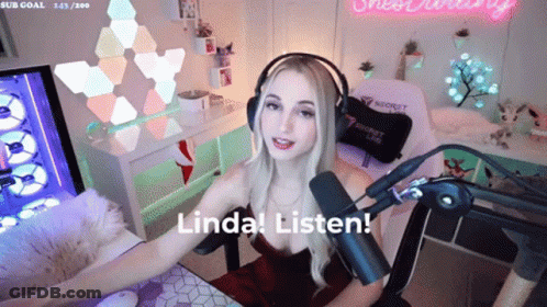 A Woman Wearing Headphones Is Sitting In Front Of A Microphone With The Words Linda Listen Behind Her GIF