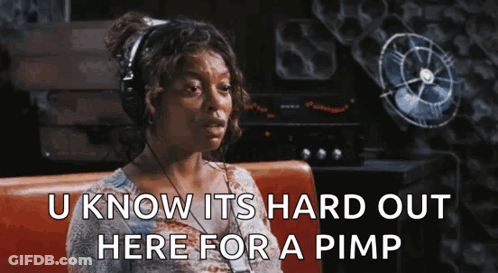 A Woman Wearing Headphones Is Sitting On A Couch And Saying `` U Know Its Hard Out Here For A Pimp '' GIF
