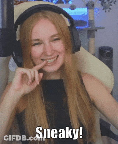A Woman Wearing Headphones Is Smiling And Says Sneaky On The Bottom GIF