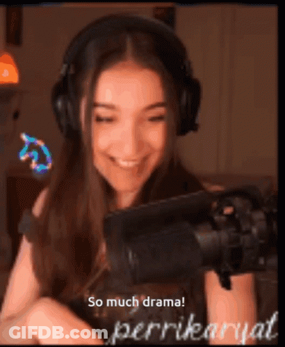 A Woman Wearing Headphones Is Smiling In Front Of A Microphone With The Words So Much Drama Written Below Her GIF
