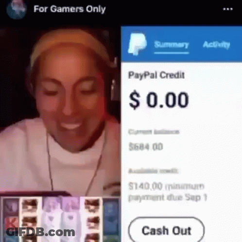 A Woman Wearing Headphones Is Smiling While Playing A Video Game On A Cell Phone . GIF