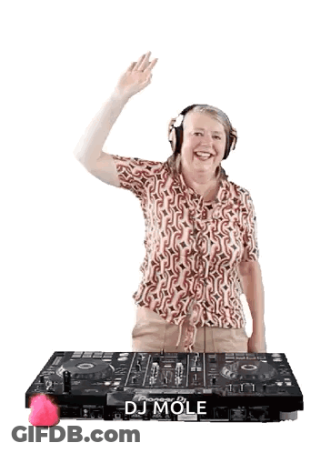 A Woman Wearing Headphones Is Standing In Front Of A Dj Mole Machine GIF