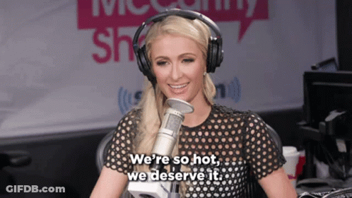 A Woman Wearing Headphones Is Talking Into A Microphone And Says " We 'Re So Hot We Deserve It " GIF