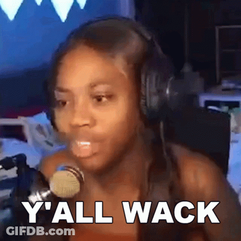 A Woman Wearing Headphones Is Talking Into A Microphone And Says Y 'All Wack GIF