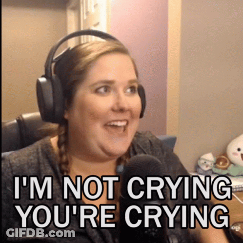 A Woman Wearing Headphones Says " I 'M Not Crying You 'Re Crying " In Front Of A Microphone GIF