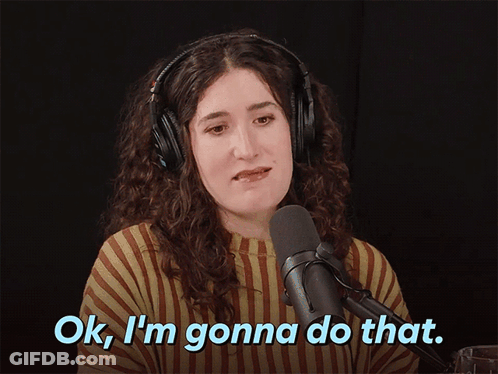 A Woman Wearing Headphones Says " Ok I 'M Gonna Do That " In Front Of A Microphone GIF