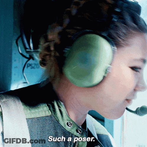 A Woman Wearing Headphones Says Such A Poser In A Close Up GIF