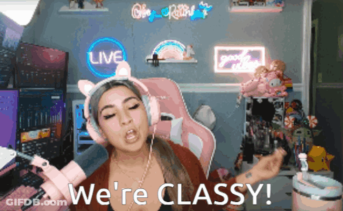 A Woman Wearing Headphones Says We 'Re Classy In Front Of A Live Sign GIF