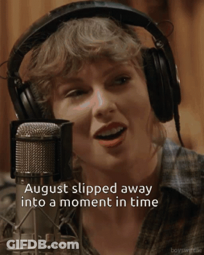 A Woman Wearing Headphones Singing Into A Microphone With The Words August Slipped Away Into A Moment In Time GIF