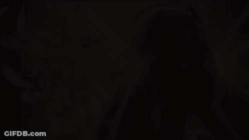 A Woman Wearing Headphones With Birds Flying Around Her GIF