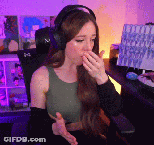 A Woman Wearing Headphones With The Letter M On The Side GIF