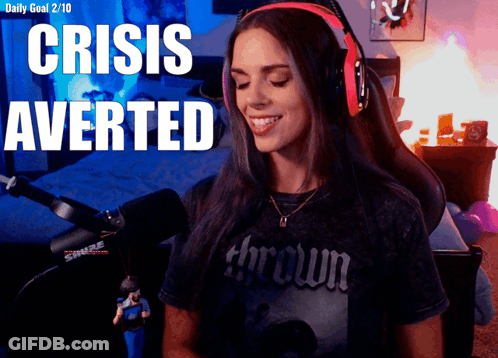 A Woman Wearing Headphones With The Words Crisis Averted GIF