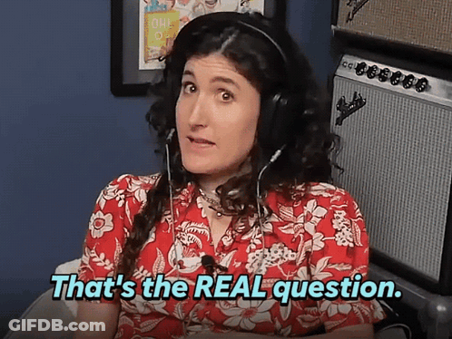 A Woman Wearing Headphones With The Words That 'S The Real Question Below Her GIF