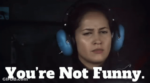 A Woman Wearing Headphones With The Words " You 'Re Not Funny " Below Her GIF