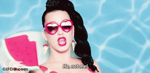 A Woman Wearing Heart Shaped Sunglasses Is Holding A Slice Of Watermelon And Saying Ha Not Me . GIF