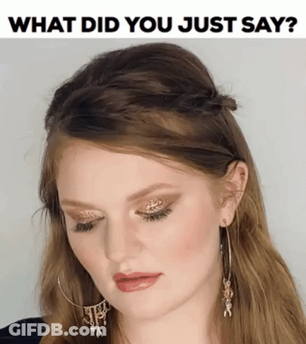 A Woman Wearing Hoop Earrings And A Headband With The Words What Did You Just Say On The Bottom GIF