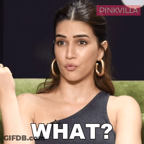 A Woman Wearing Hoop Earrings Is Making A Funny Face And The Word What Is On Her Face GIF