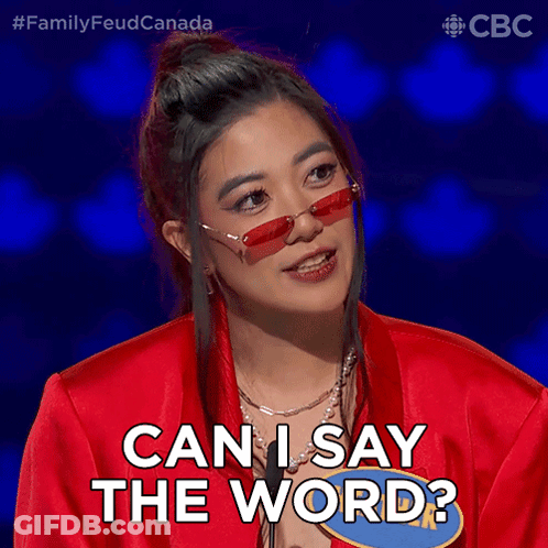 A Woman Wearing Red Sunglasses And A Red Jacket Says Can I Say The Word GIF