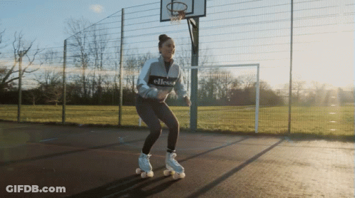 A Woman Wearing Roller Skates With The Word Ellesse On The Front GIF