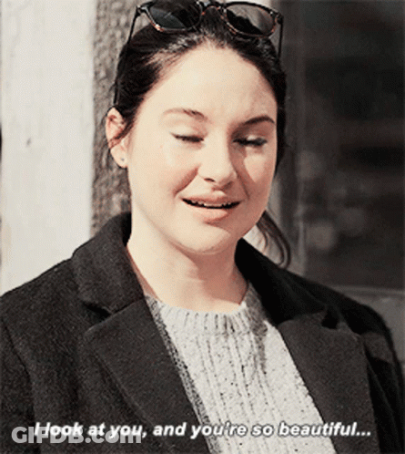 A Woman Wearing Sunglasses And A Black Coat Says I Look At You And You 'Re So Beautiful GIF