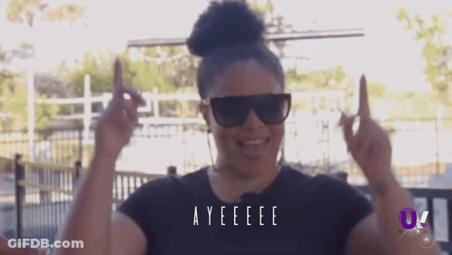 A Woman Wearing Sunglasses And A Black Shirt With The Word Ayeeee On It GIF