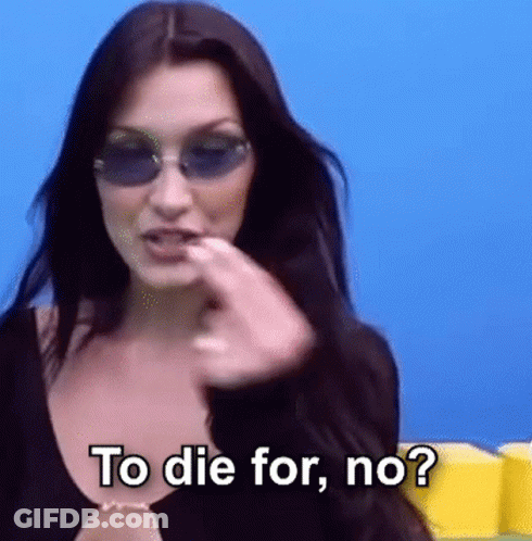 A Woman Wearing Sunglasses And A Black Top Is Asking To Die For , No ? GIF