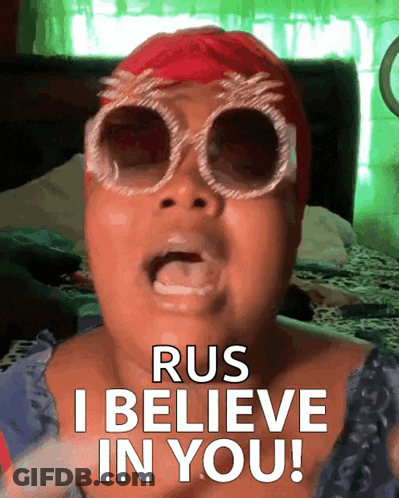 A Woman Wearing Sunglasses And A Red Hat Says Rus I Believe In You GIF
