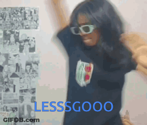 A Woman Wearing Sunglasses And A Shirt That Says Lessgood On It GIF