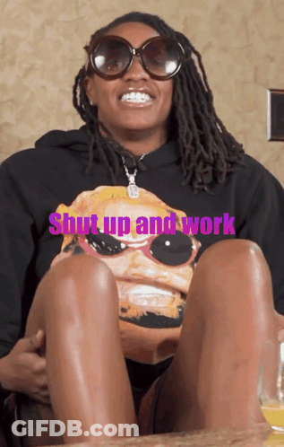 A Woman Wearing Sunglasses And A Shirt That Says " Shut Up And Work " GIF