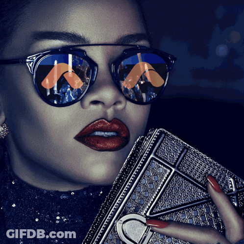 A Woman Wearing Sunglasses And Red Lipstick Holds A Purse GIF