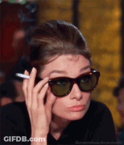 Woman Wearing Sunglasses Holding Cigarette GIF