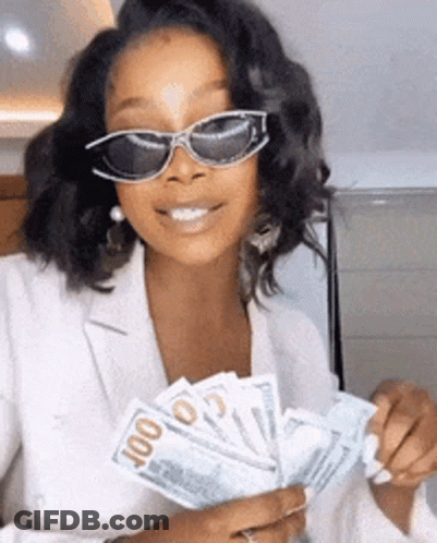 A Woman Wearing Sunglasses Is Holding A Fan Of Money In Her Hands . GIF