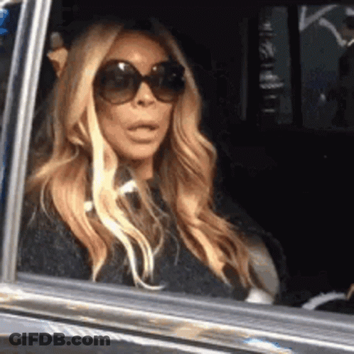 Woman Looking Out Car Window GIF