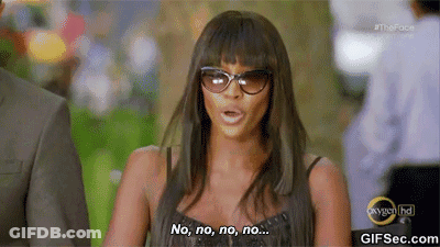 A Woman Wearing Sunglasses Is Saying No , No , No , No .. GIF