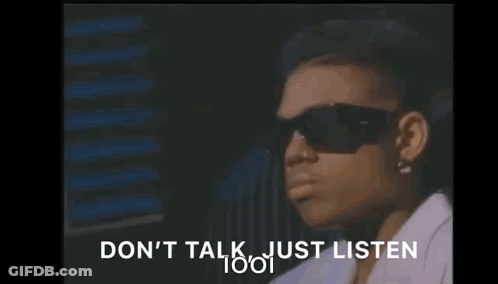 A Woman Wearing Sunglasses Is Sitting In Front Of A Window And Says `` Do N't Talk Just Listen '' . GIF