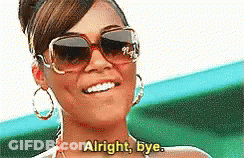A Woman Wearing Sunglasses Is Smiling And Saying Alright Bye GIF