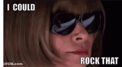 A Woman Wearing Sunglasses Says " I Could Rock That " On The Bottom GIF