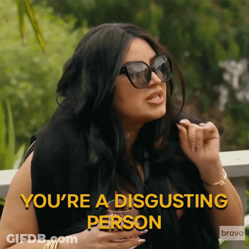 A Woman Wearing Sunglasses Says " You 'Re A Disgusting Person " In Yellow Letters GIF