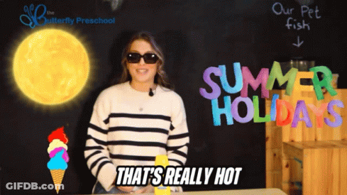 A Woman Wearing Sunglasses Stands In Front Of A Blackboard That Says Summer Holidays GIF