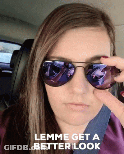 A Woman Wearing Sunglasses With The Words " Lemme Get A Better Look " Below Her GIF