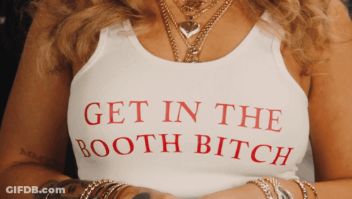 A Woman Wears A Tank Top That Says Get In The Booth Bitch GIF