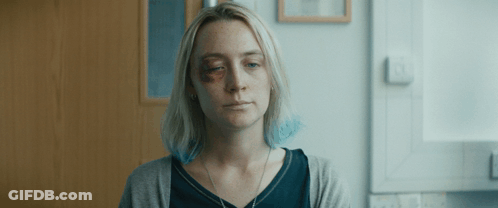 A Woman With A Black Eye And A Necklace On Her Neck GIF