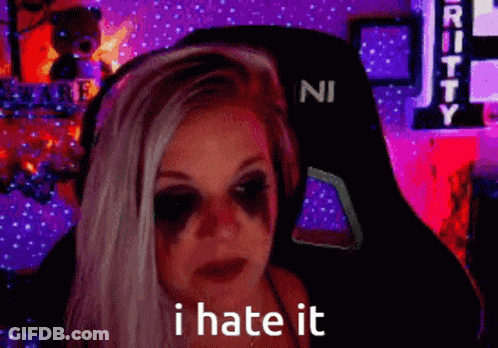 A Woman With A Black Eye Has The Words I Hate It On Her Face . GIF