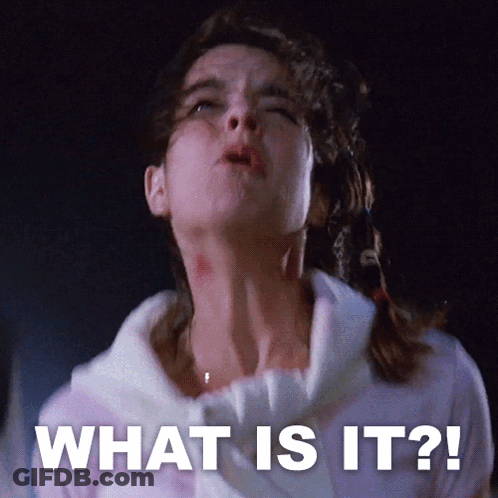 A Woman With A Bloody Neck And The Words What Is It GIF