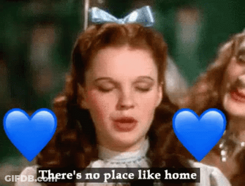 A Woman With A Blue Bow On Her Head Is Surrounded By Blue Hearts And The Words " There 'S No Place Like Home " GIF