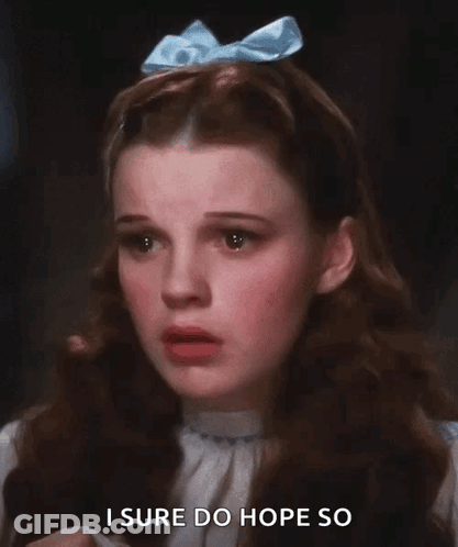A Woman With A Blue Bow On Her Head Says I Sure Do Hope So GIF