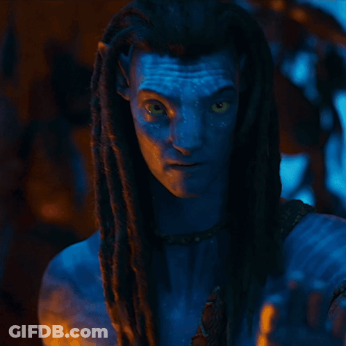 A Woman With A Blue Face And Braided Hair Is Wearing A Scarf That Says ' Snake ' On It GIF