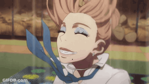 A Woman With A Blue Tie Around Her Neck Smiles GIF