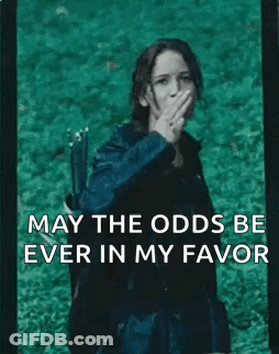 A Woman With A Bow And Arrow Is Covering Her Mouth With Her Hand And The Words May The Odds Be Ever In My Favor GIF