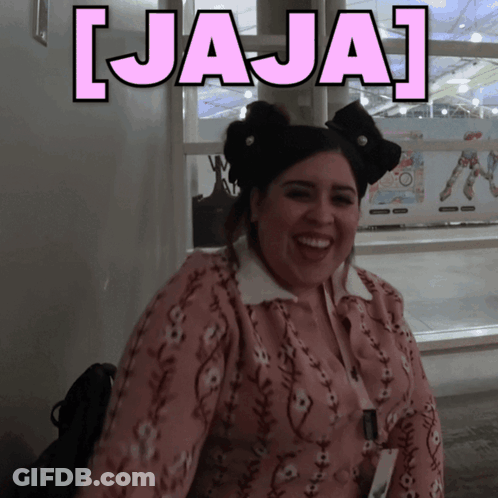 A Woman With A Bow In Her Hair Is Smiling In Front Of A Sign That Says ' Jaja ' GIF